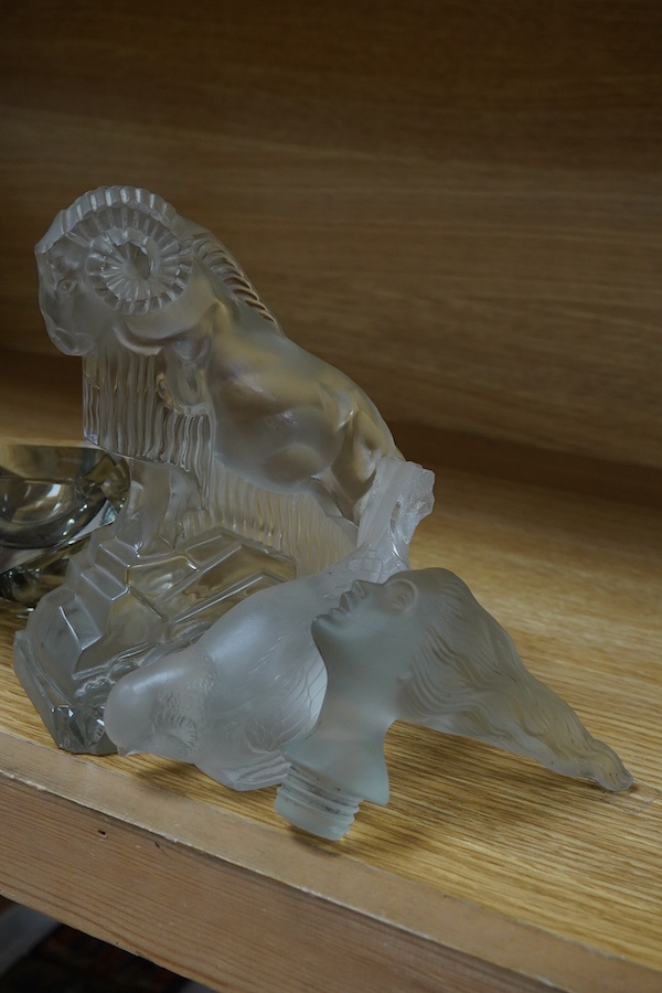 Two Lalique glass figures; a kneeling woman and deer group, a budgerigar, together with a Ronson ‘Senator’ Shell BP desk lighter, a Murano glass ash tray, an Art Deco style glass ram, etc. (7). Condition - poor to fair.